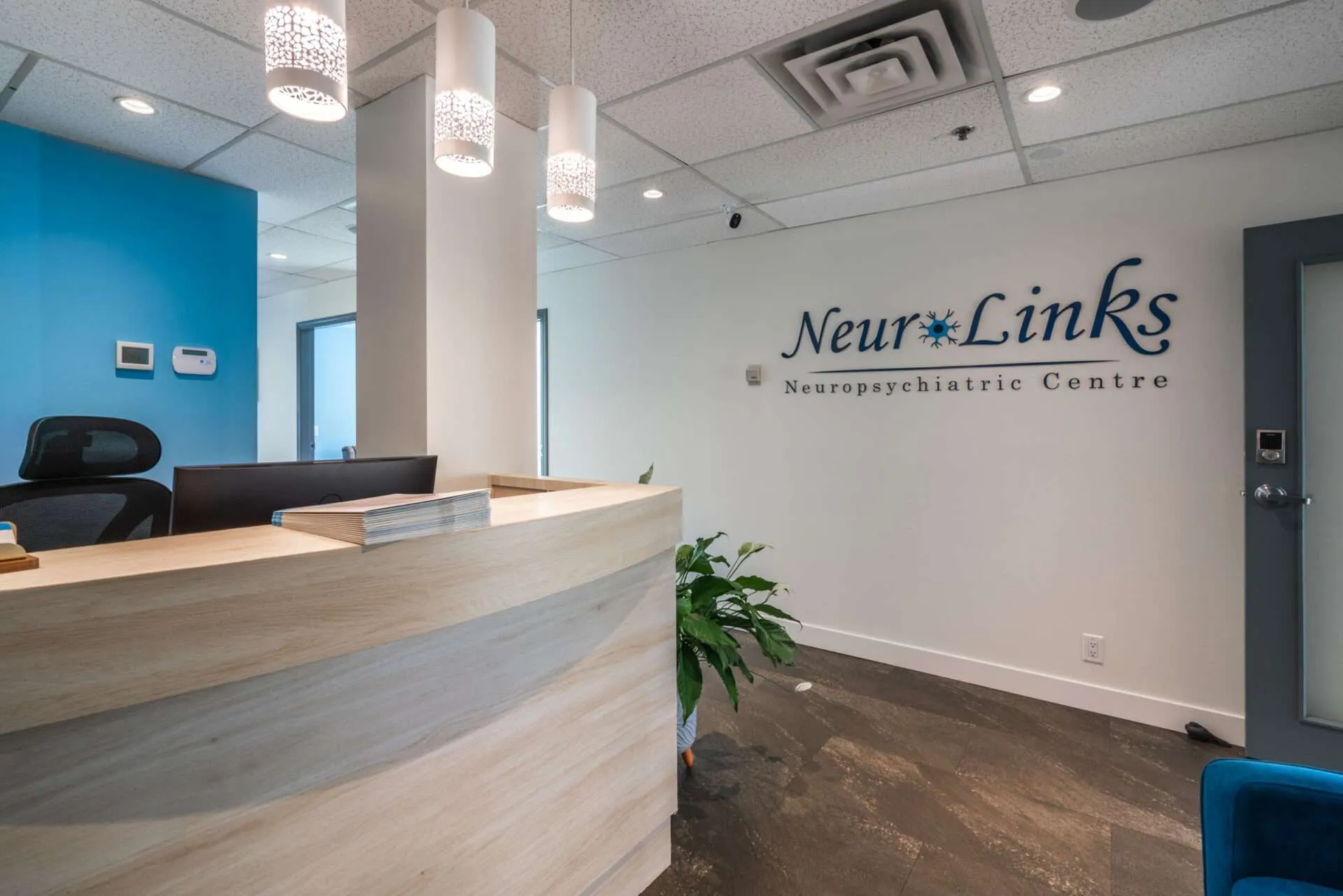 NeuroLinks reception area with the clinic name displayed on the wall